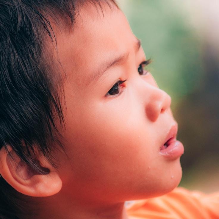 Alex Kim, Lead Design Curator at CandleGroveAtlas, reviewing corporate floral arrangements